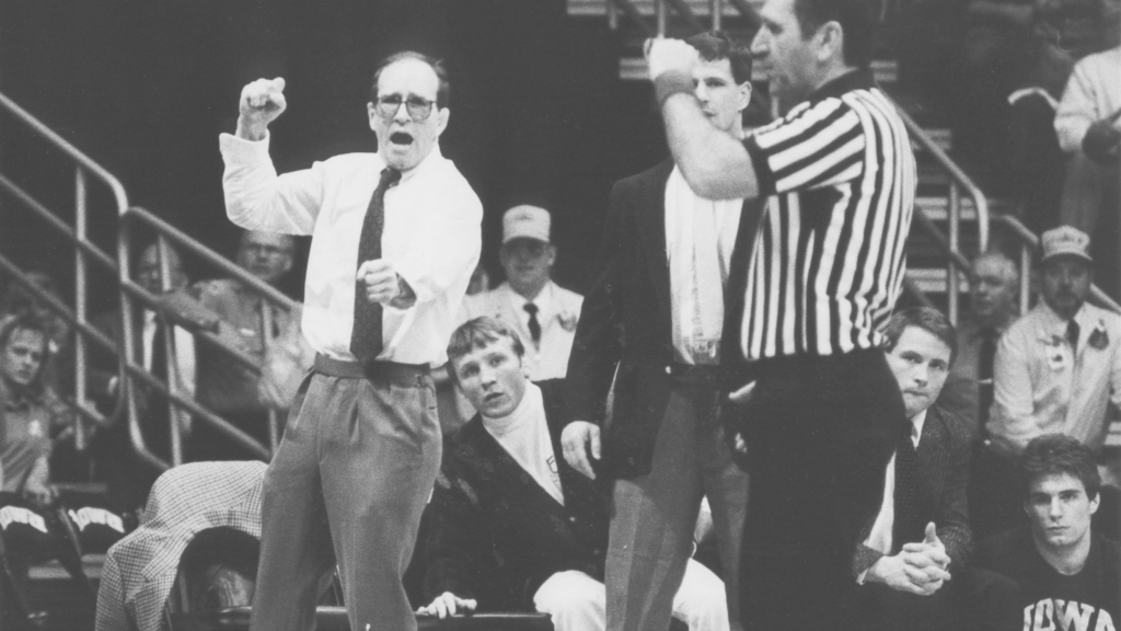 A photograph of Iowa wrestling coach Dan Gable during a match 