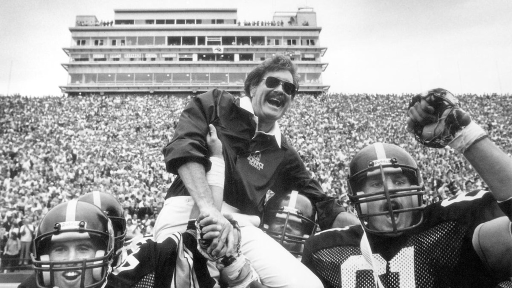 Hayden Fry is carried off the field by players after the Hawkeyes clinch their first Rose Bowl berth in 34 years. 