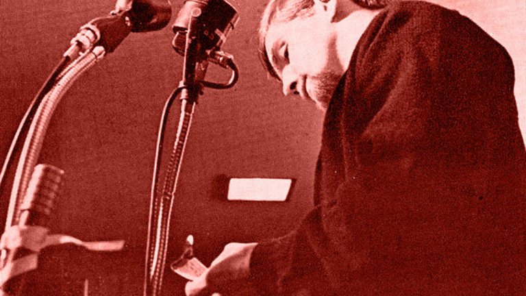 University of Iowa student Steve Smith burns his draft card at the Iowa Memorial Union on October 20th, 1965